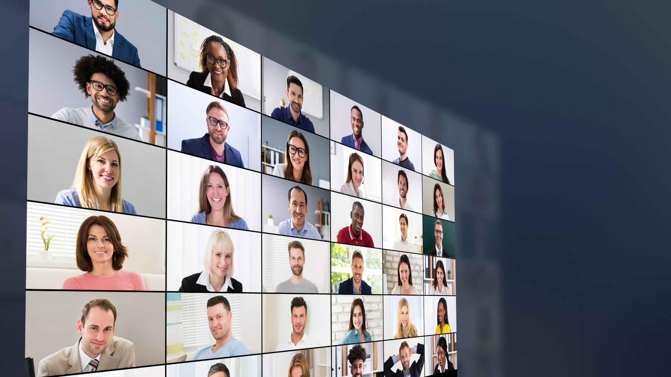 Large monitor with pictures of group coaching attendees engaging with each other.