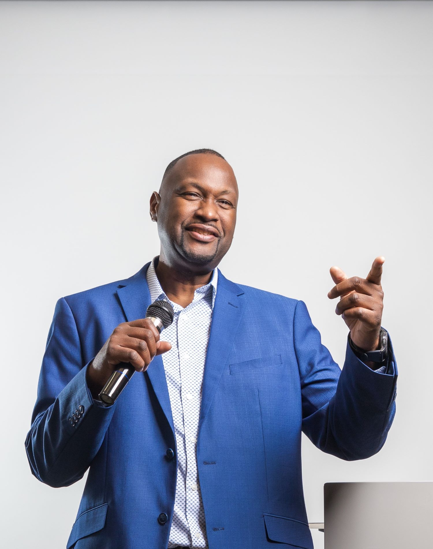 Dr. John answering a question from a leader after giving a motivational speech.