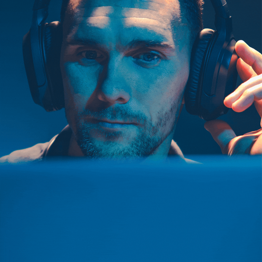 Gif of man wearing headphones listening to AMPED Leadership Podcast.