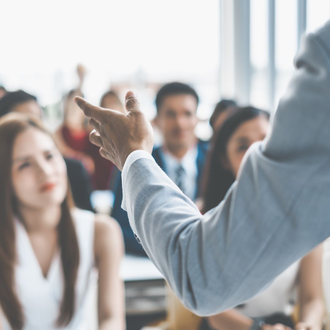 Left hand gesture while giving a speech.